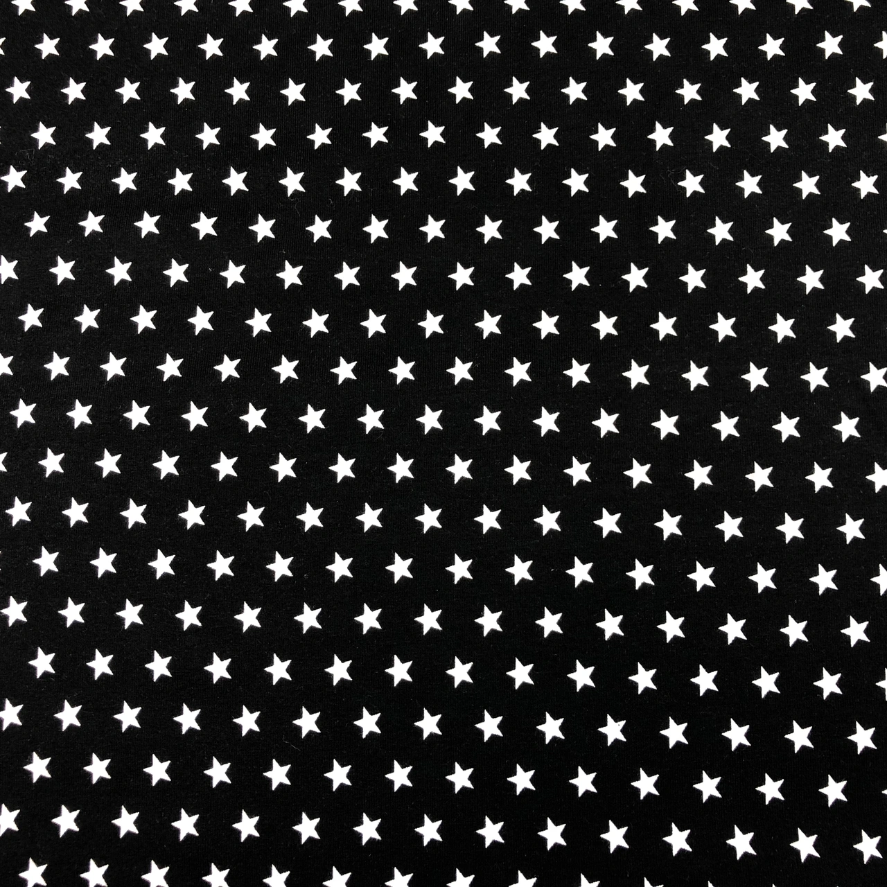 Svart med stjärnor Trikåtyg